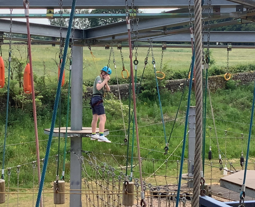 Pupil walking on high ropes
